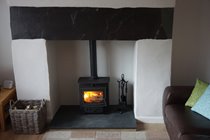 Wood burning stove with original Welsh slate lintel