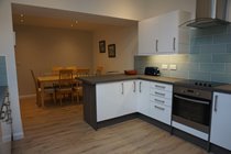 Kitchen leading into dining area