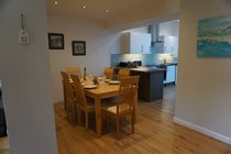 Dining area leading into kitchen