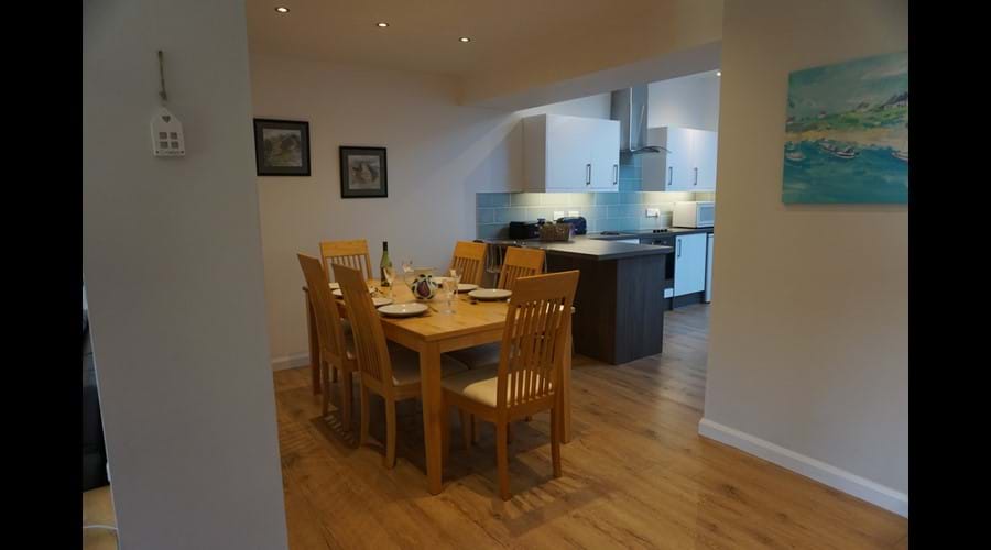 Dining area leading into kitchen