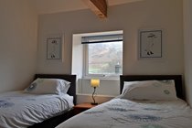 Bedroom 2 with twin beds with rear view