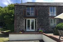 Coach Cottage showing ground floor bedroom patio door