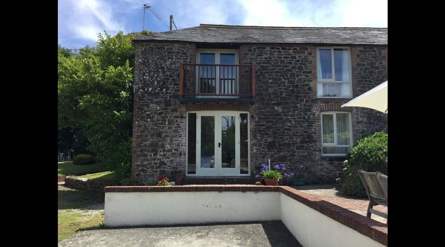 Coach Cottage showing ground floor bedroom patio door