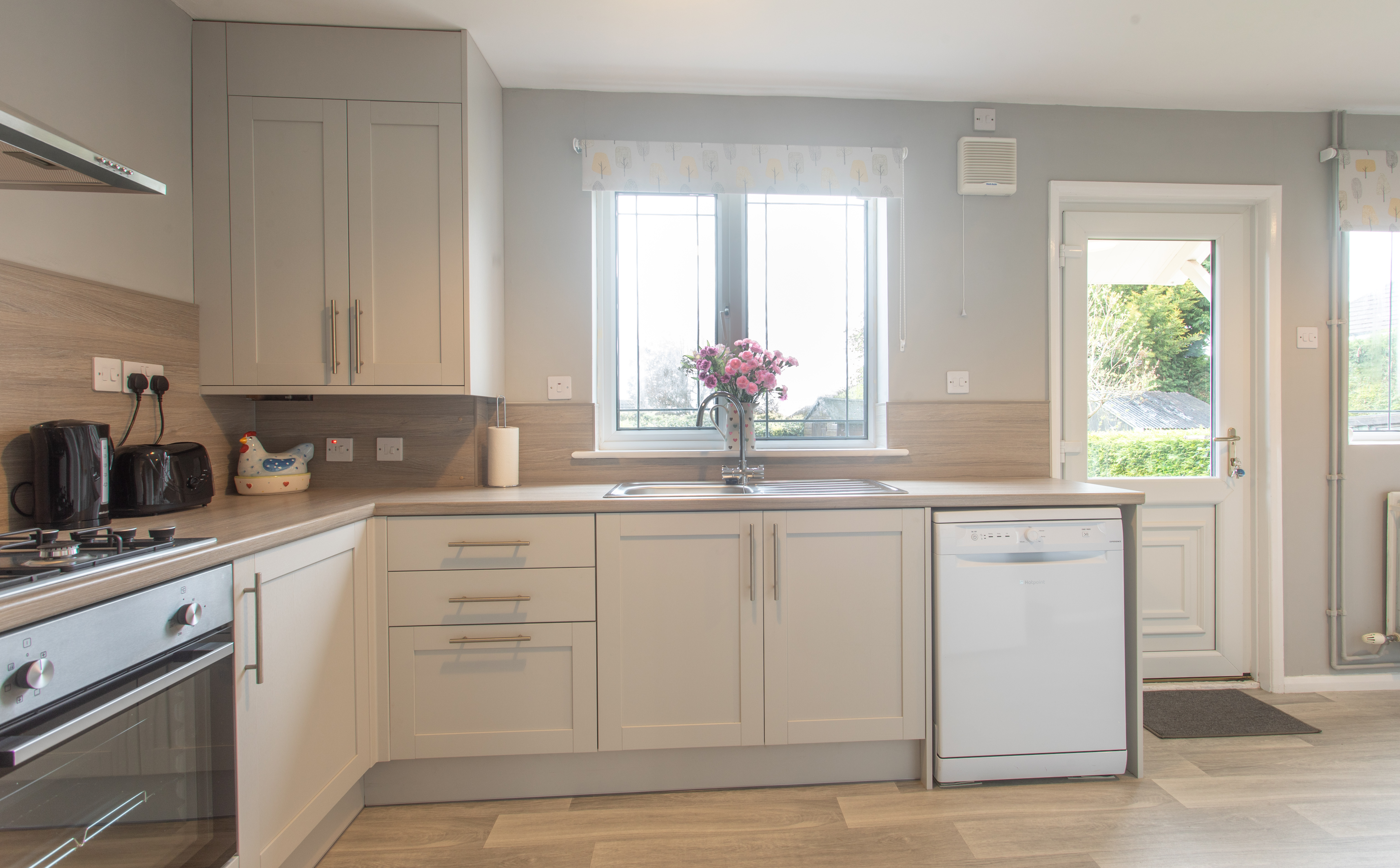 The kitchen has a fan oven, gas hob, dishwasher, microwave and fridge-freezer.