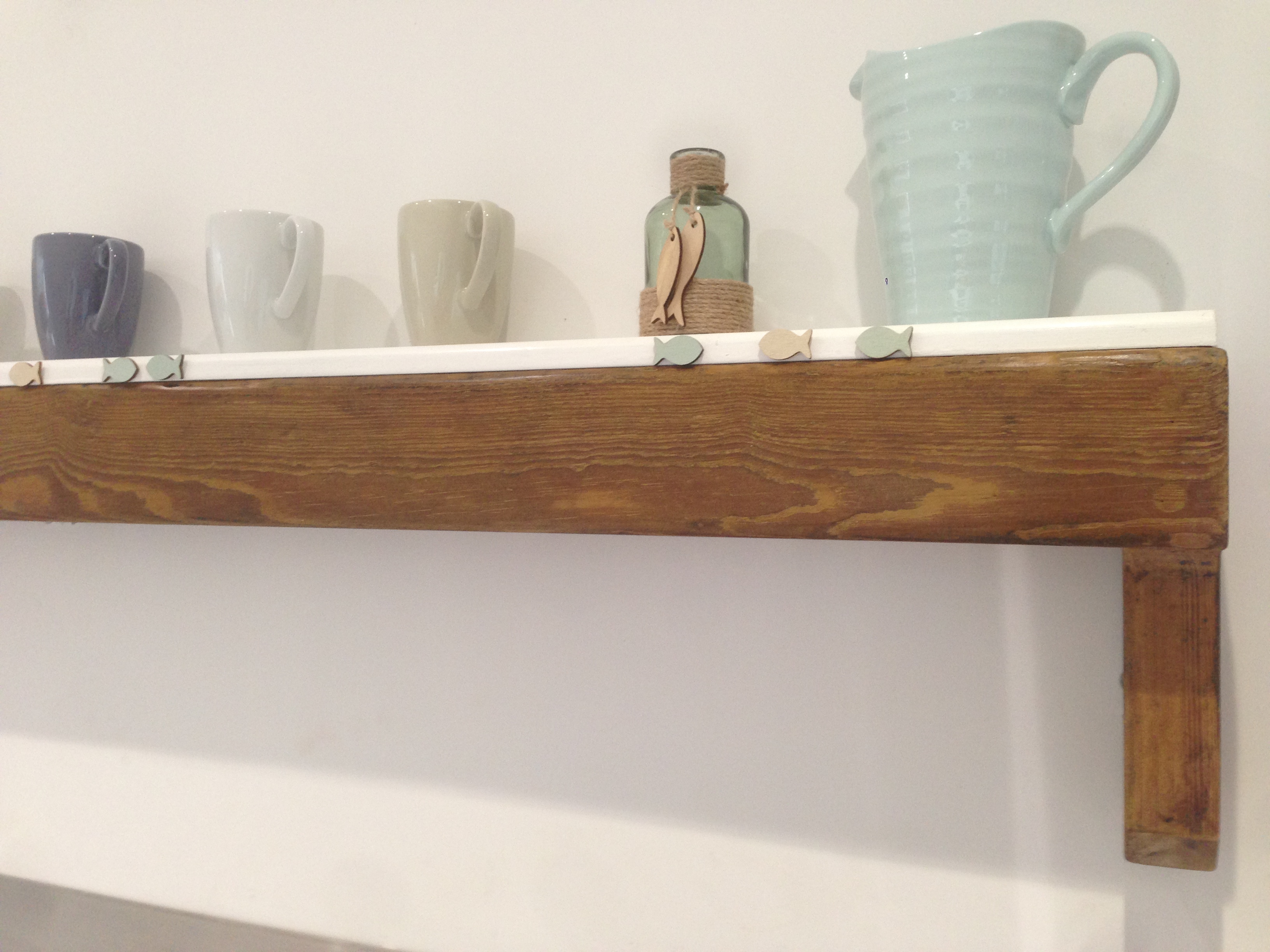 Re-purposed church pew as kitchen shelf
