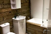 Re-purposed wood-clad bathroom, Chapel Bay Lodge