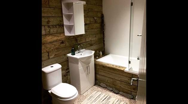 Re-purposed wood-clad bathroom, Chapel Bay Lodge