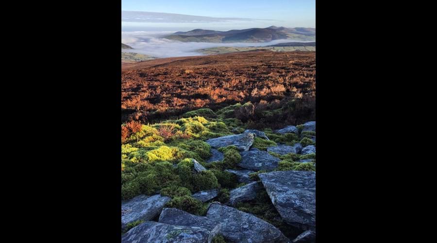 Rolling mists, looking across central valley from the top of South Barrule