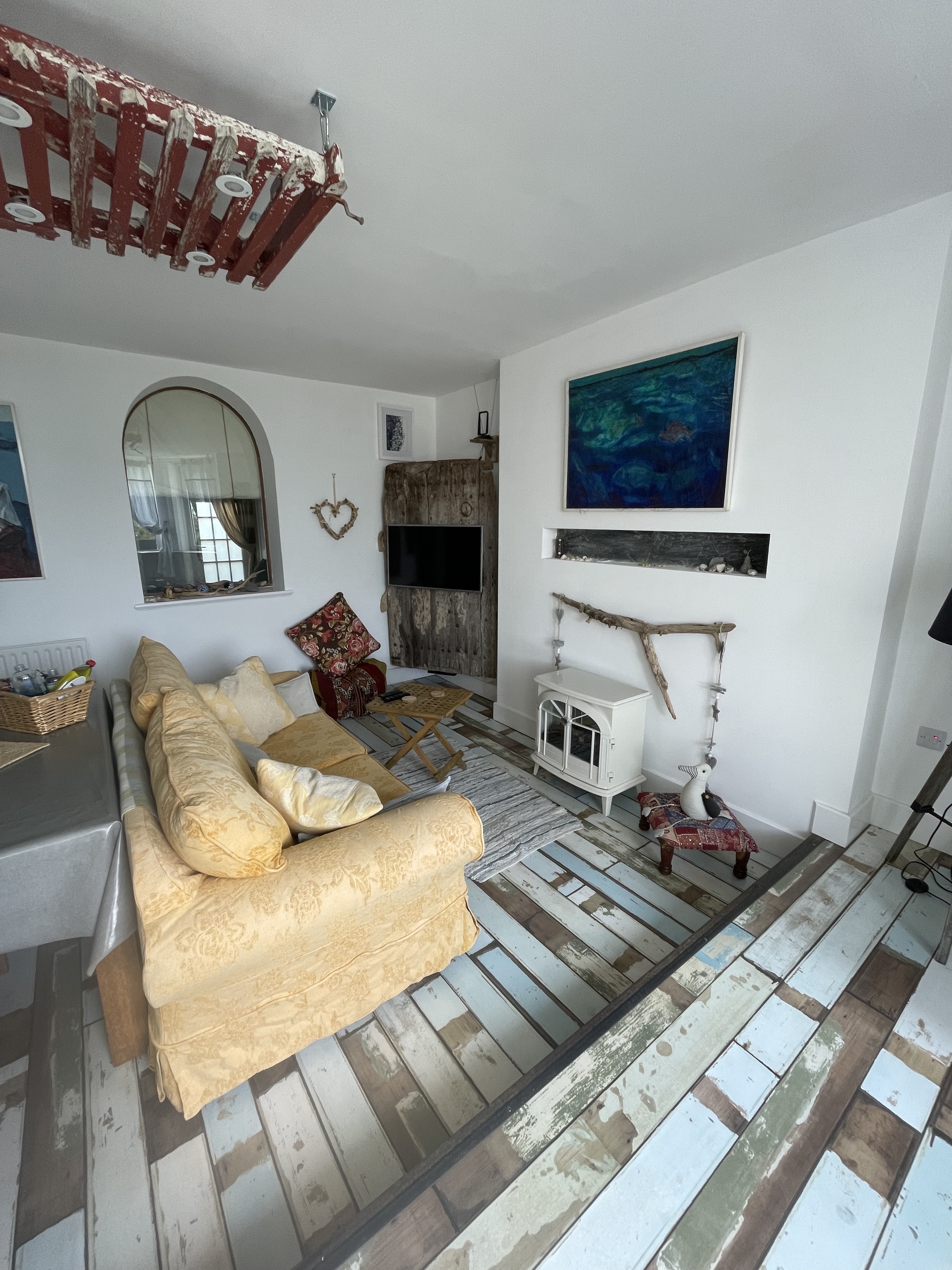 Lounge/dining area, with internal window through to bedroom
