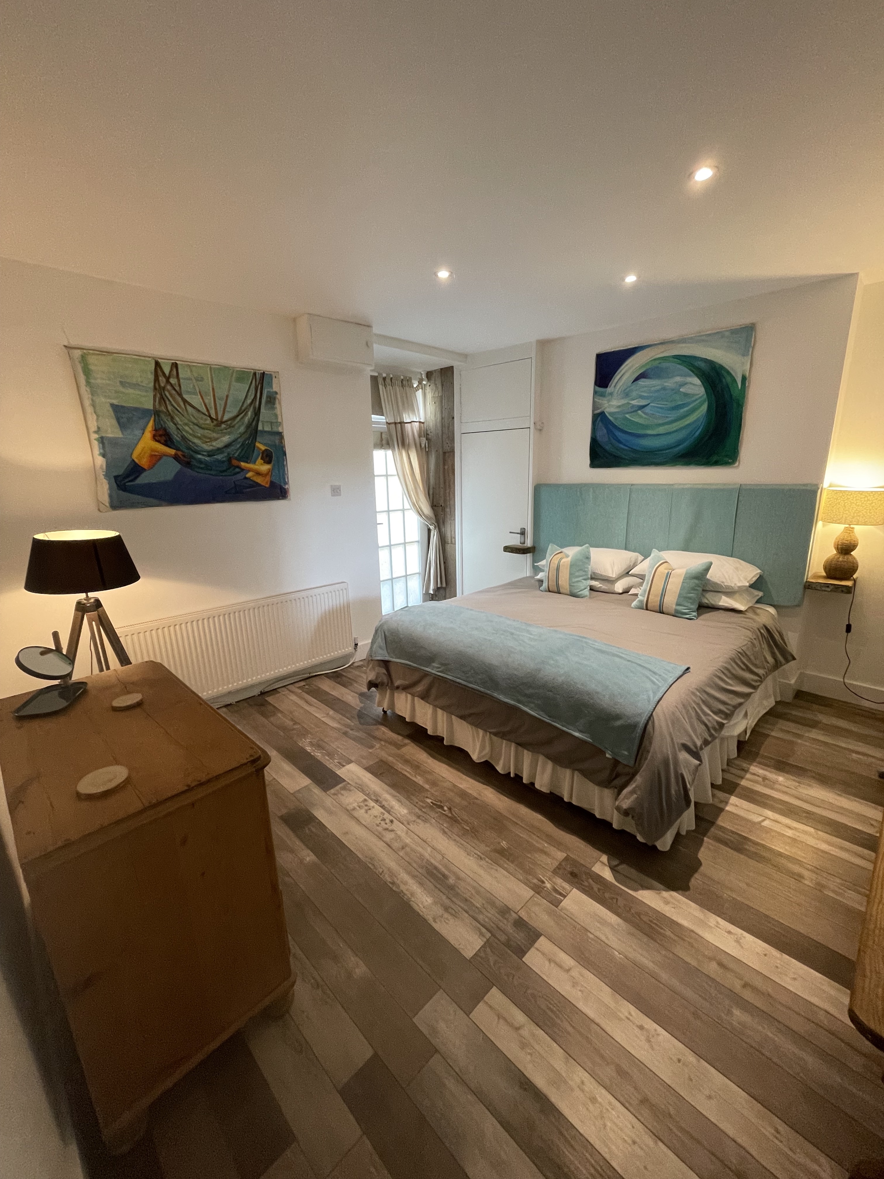 Bedroom with super king size bed, back door leading to rear steps 