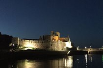 Peel Castle illuminated at dusk