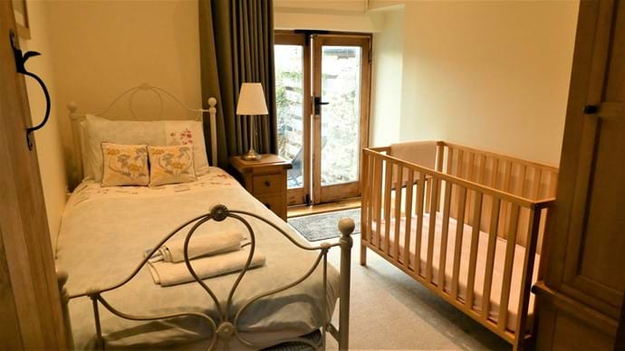 Single Room set up with a Cot; perfect for a young family