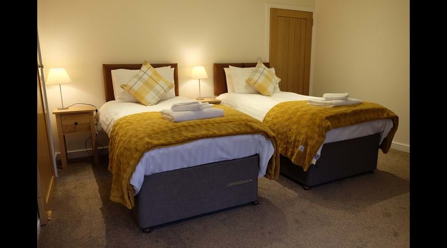 The larger bedroom can also be configured with two, full-sized single beds.
