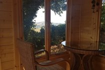Our garden summerhouse - a log cabin equipped with lovely conservatory furniture
