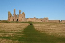 Dunstanburgh Castle, approaching from Craster
