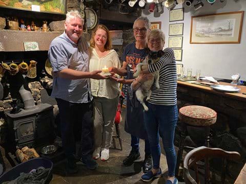 Passing the candle from Ed, Jackie and George to Greg and Claire