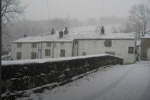 snow-covered-scene-of-the-george-inn-hubberholme
