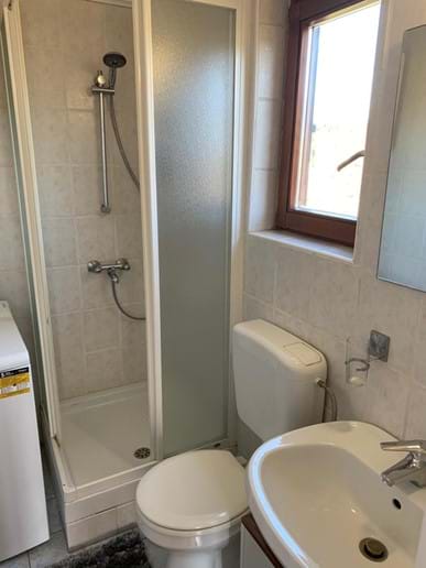 Shower room with clothes washing facilities