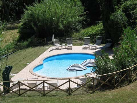 Swimming pool, sun terrace and view to land
