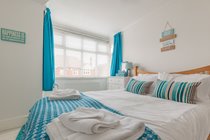 The main bedroom with a king size bed and a sea glimpse!