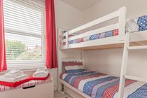 The bunk bed room has a bright, fun colourscheme that children love