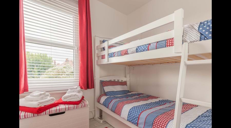 The bunk bed room has a bright, fun colourscheme that children love