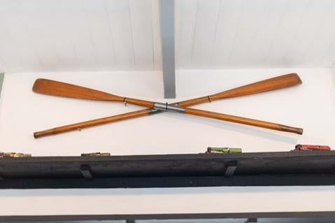 Our antique oars mark the boat house hoist 