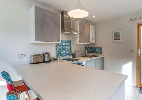 Breakfast bar and fully fitted kitchen for long lazy breakfasts and cozy nights in
