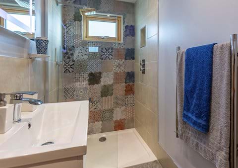Walk in rain water shower, big enough for 2 and those tiles! Everyone loves the ensuite!