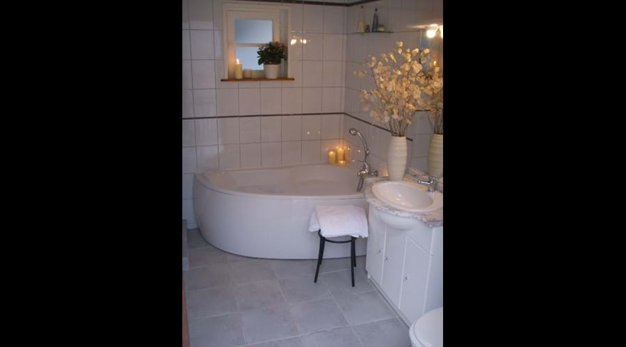 Bathroom with bath...