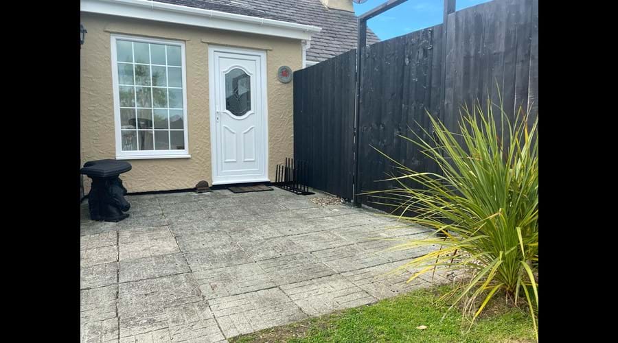 Door from garden, the gate opens on to the parking area)