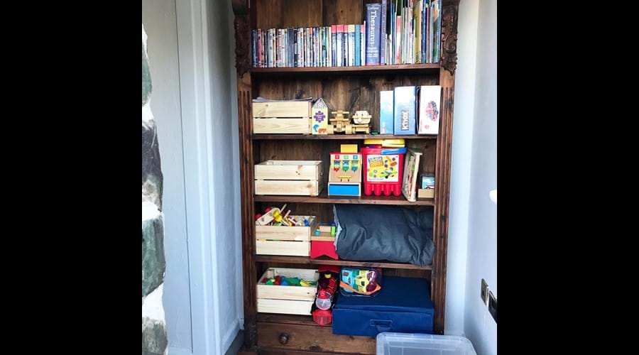 Toys, books & DVDs in the lounge ready for younger guests