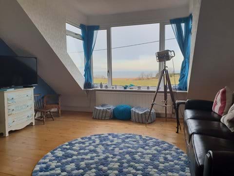 Spacious upstairs sitting room with smart tv, chest full of games and that fabulous sea view!