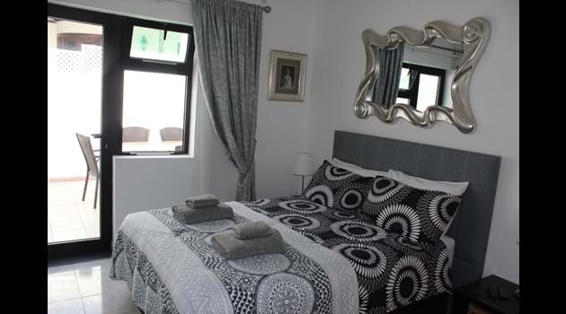 Bed 2 double bed with en-suite shower + toilet and its own private patio + air con