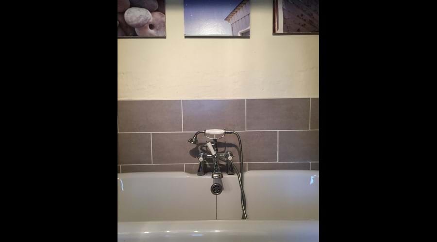 Downstairs bathroom with bath and separate shower