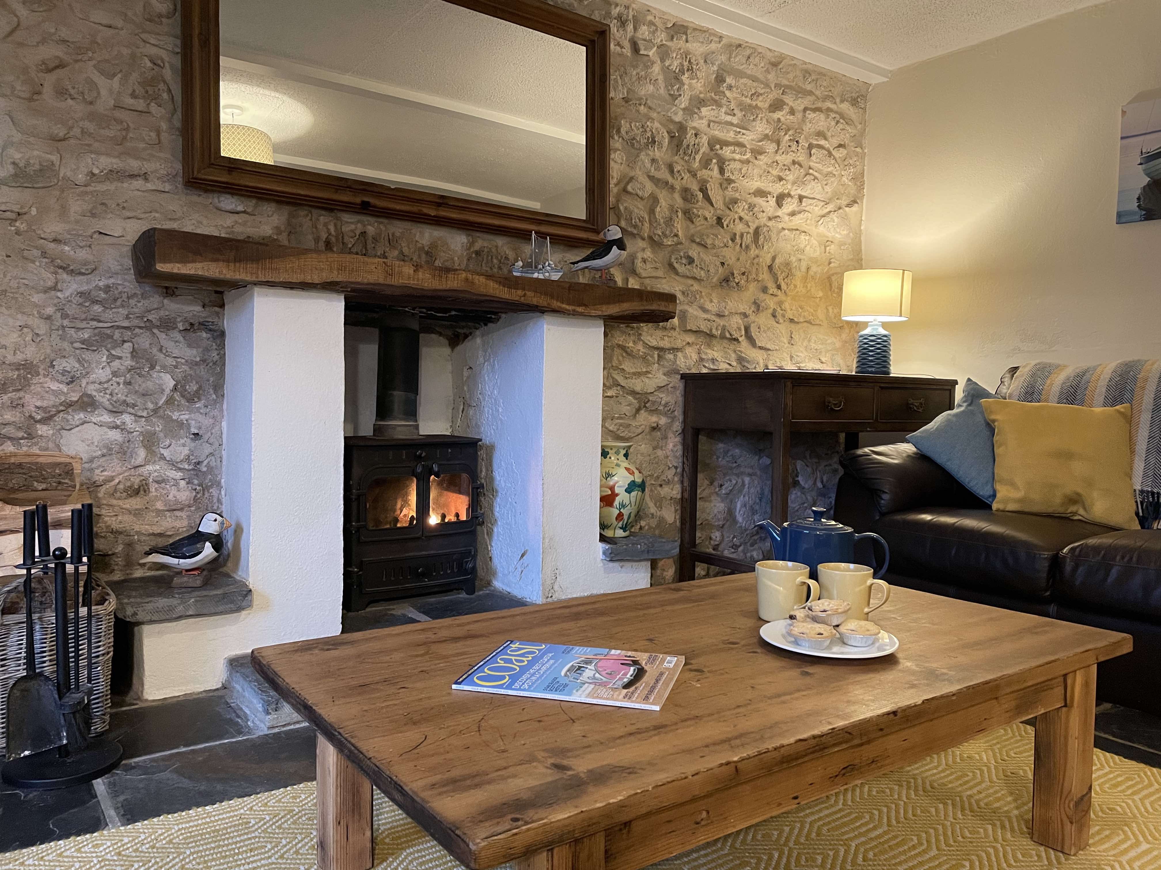 Relax with a magazine and cup of tea in front of the fire 