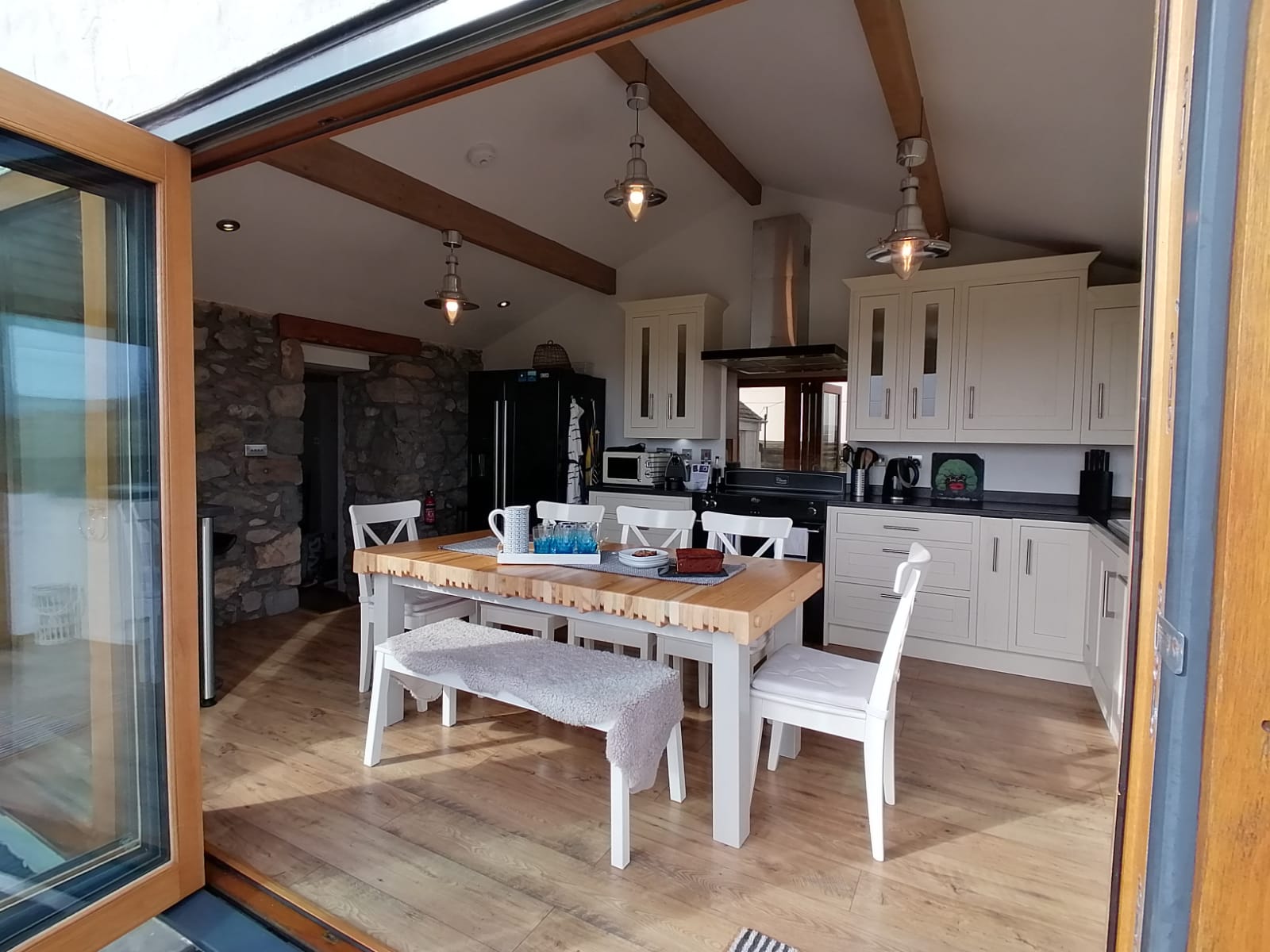 Spacious kitchen with bi-folding doors for fabulous sea, mountain and countryside views