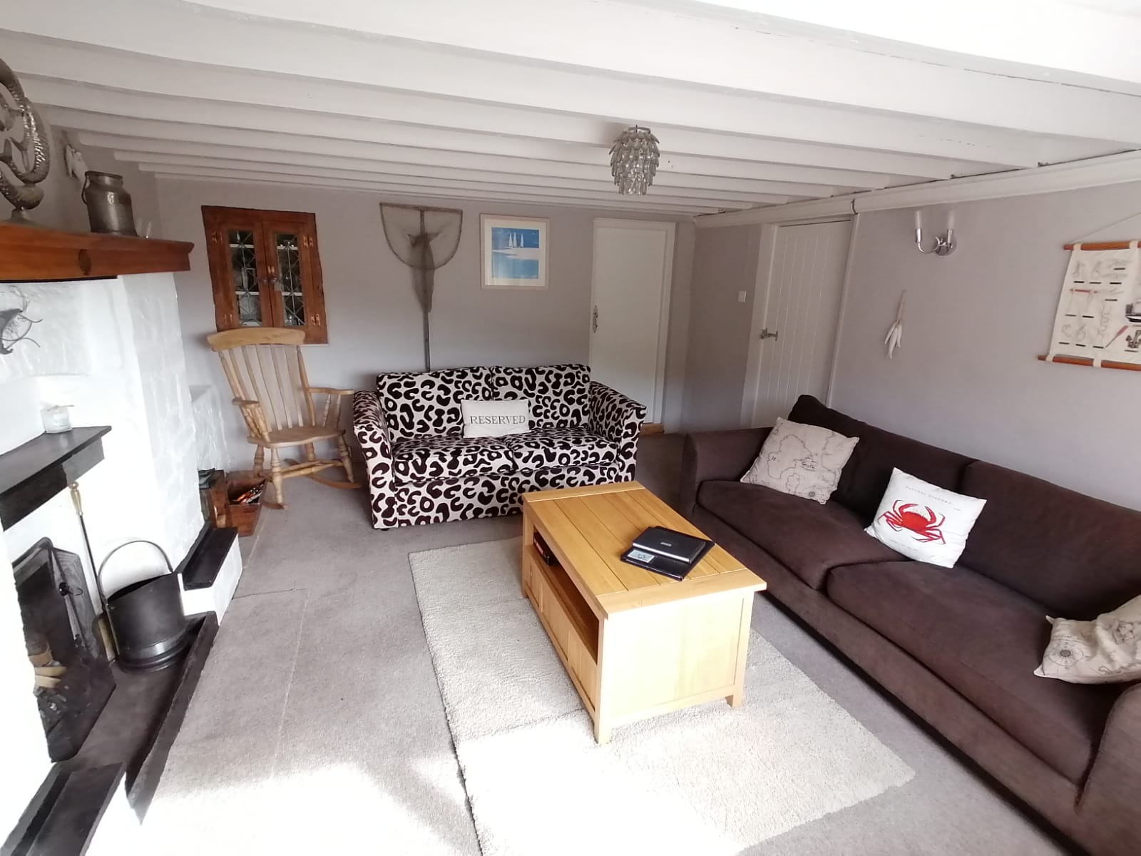 Plentiful seating in the lounge with open fire and beamed ceiling