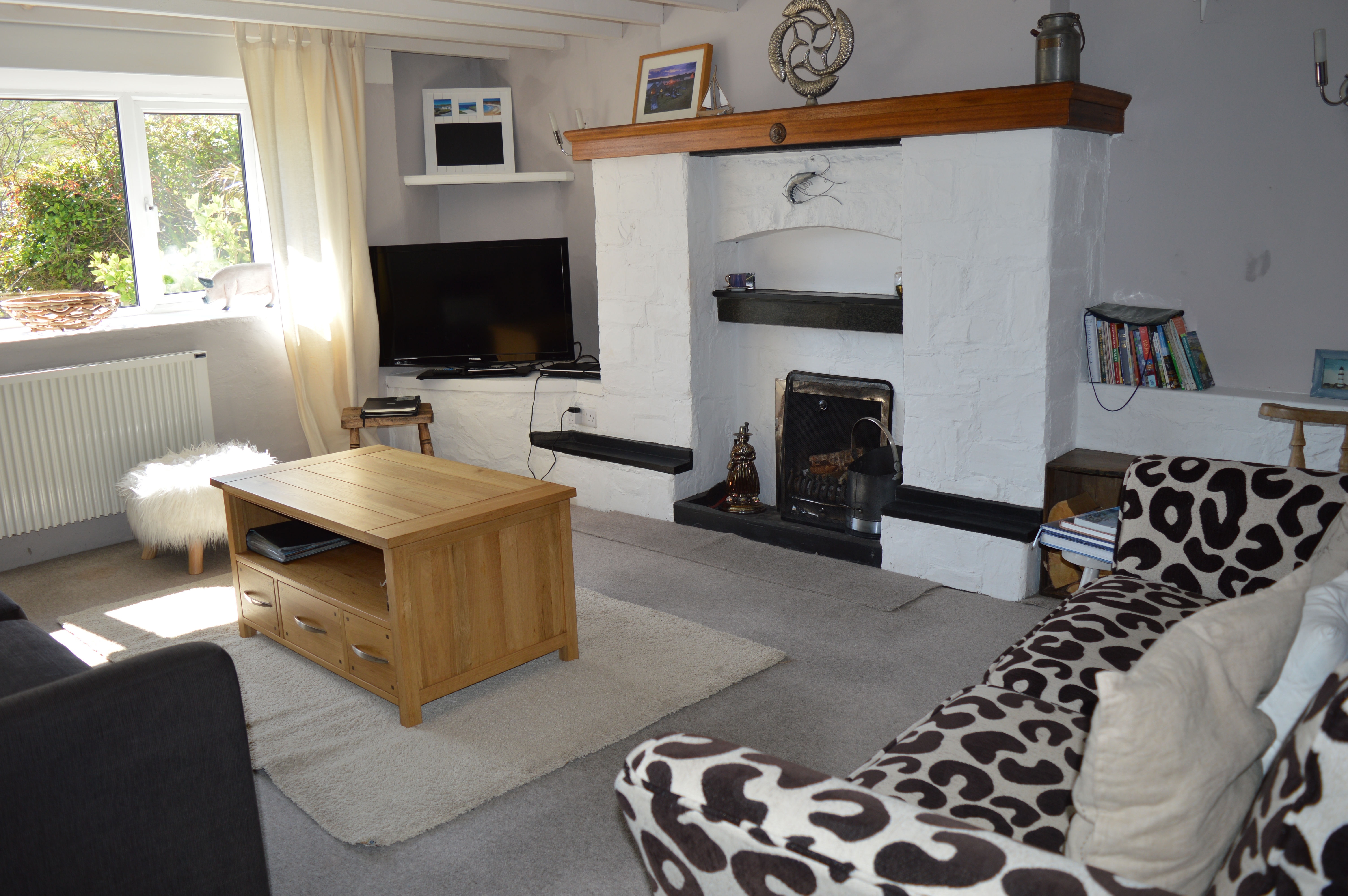Spacious lounge with beamed ceiling, open fire, flat screen TV and DVD and ample seating for 8