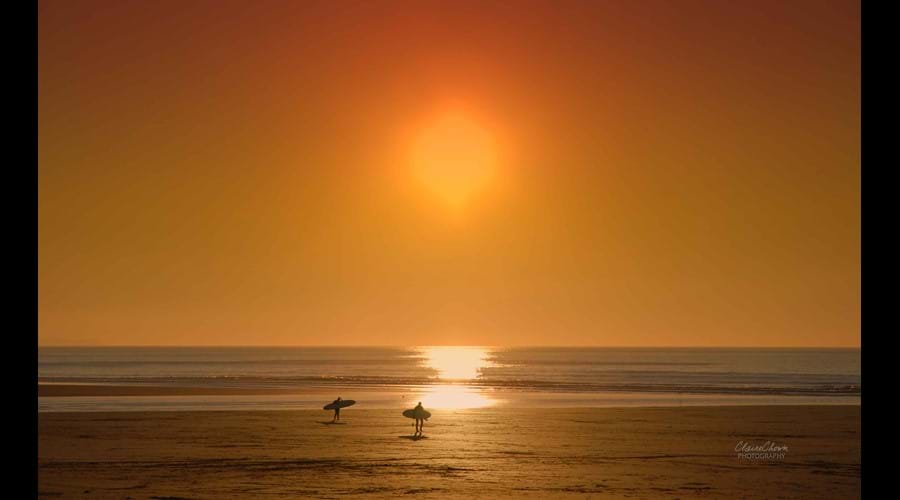 Sunset and surfers at Woolacombe