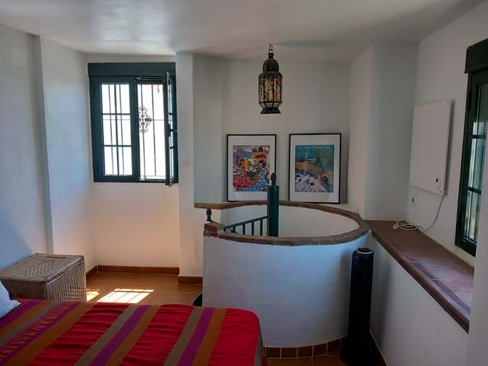 Twin Bedroom Accessible by Spiral Staircase at Casa Vista Castillo in Arcos de la Frontera Photo