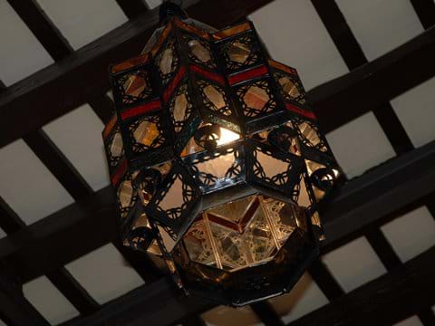 Sensational Moroccan lanterns hanging from a traditional Spanish beamed ceiling Photo