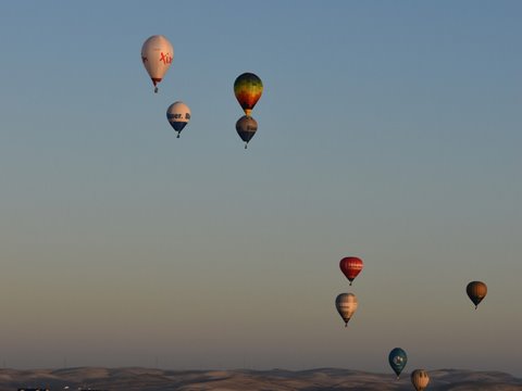 Hot air balloon competition floating across Arcos de la Frontera Photo