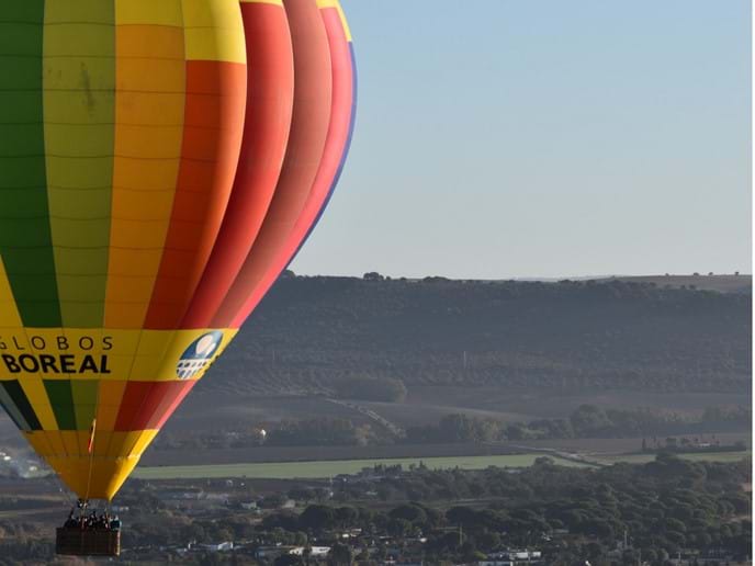 Hot air balloon flying close by in Arcos de la Frontera in Cadiz, Andalusia, Spain Photo