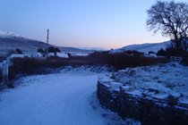 View down the lane in the snow
