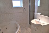 Main Bathroom with built in Whirlpool bath and separate shower cubicle.