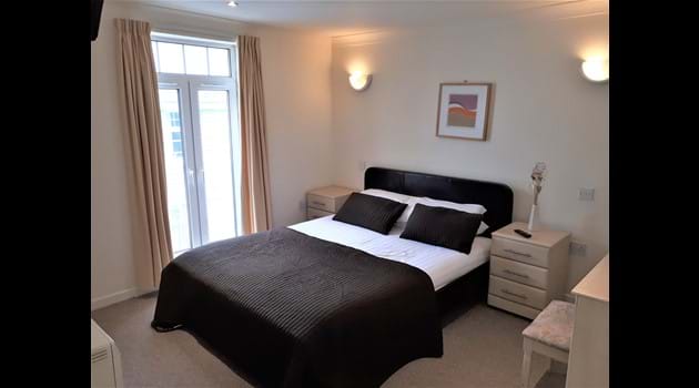 Master Bedroom with En-Suite Shower Lodge 34,  at Atlantic Reach Resort. www.newquay-selfcatering.com
