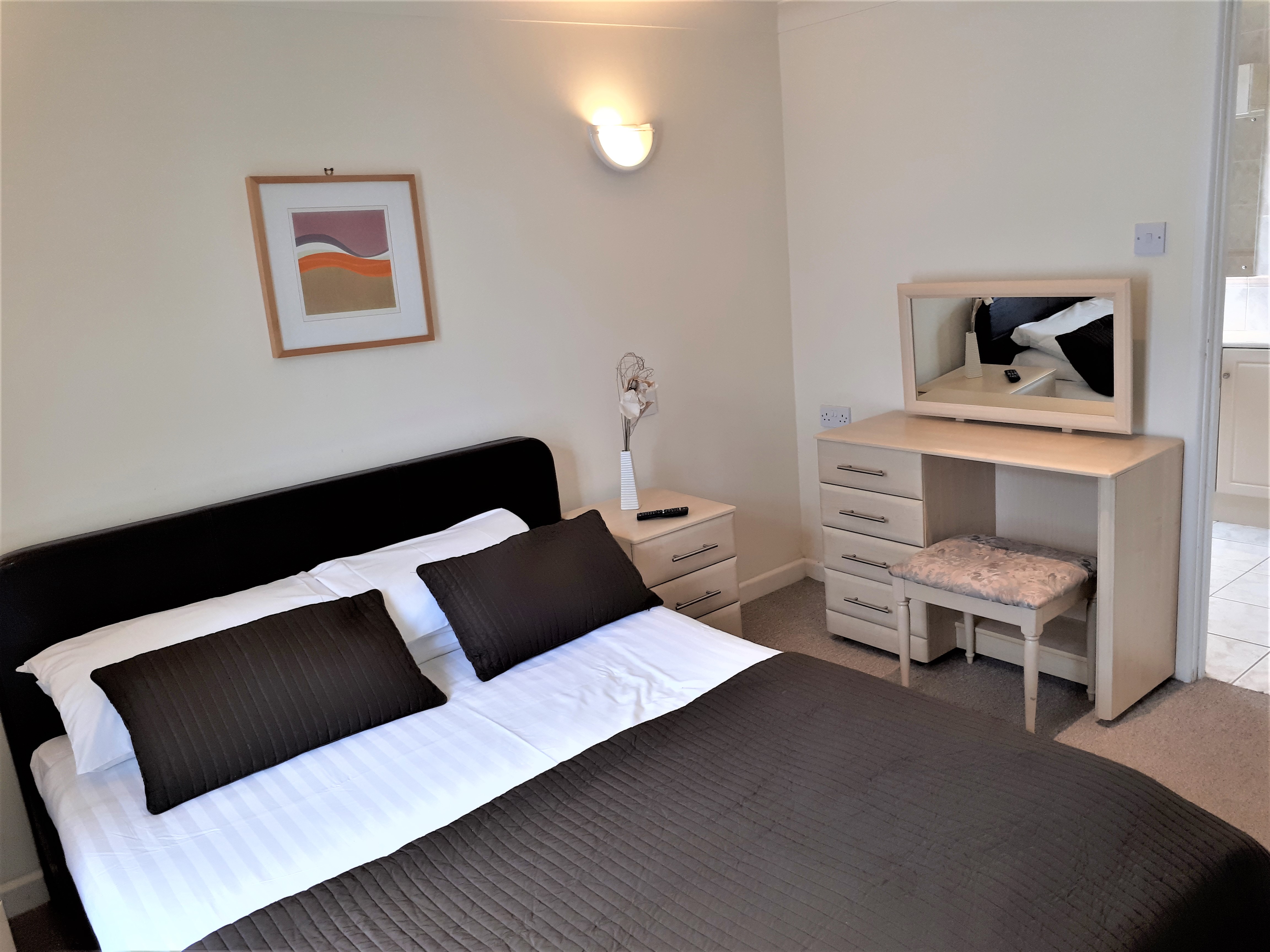 Master Bedroom with En-Suite Shower Lodge 34,  at Atlantic Reach Resort. www.newquay-selfcatering.com