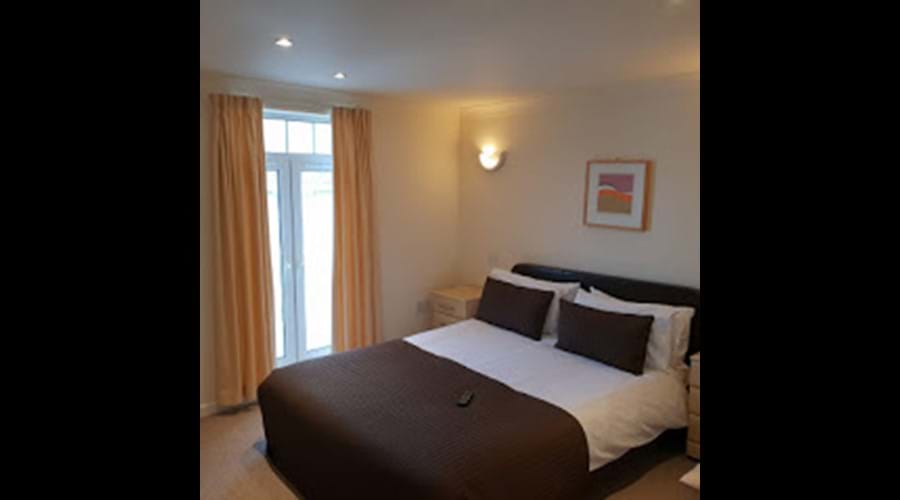 Master Bedroom with King size Bed and Smart tv. AG34