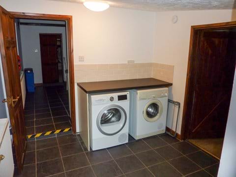 Enter via utility room with washing machine and tumble dryer